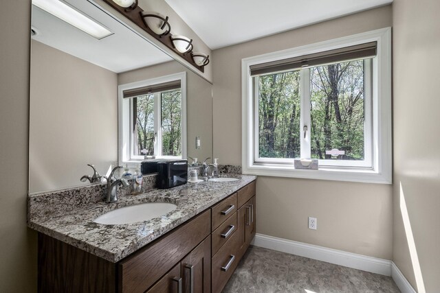 4624 Parman Rd, Stockbridge, MI 49285 - bathroom with baseboards and double vanity