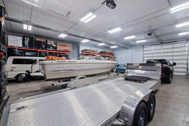4624 Parman Rd, Stockbridge, MI 49285 - garage featuring a garage door opener