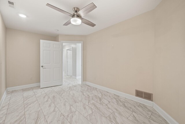 4624 Parman Rd, Stockbridge, MI 49285 - unfurnished room featuring ceiling fan, baseboards, and light marble finish floors