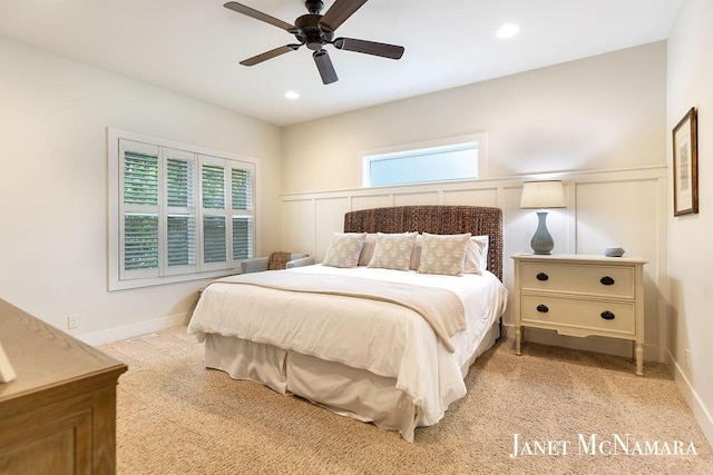 2078 Chippewa Dr Unit 25, Holland, MI 49424 - bedroom featuring light colored carpet, a decorative wall, a ceiling fan, recessed lighting, and wainscoting