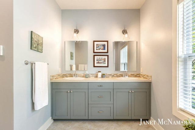 2078 Chippewa Dr Unit 25, Holland, MI 49424 - bathroom featuring double vanity, baseboards, healthy amount of natural light, and tile patterned flooring