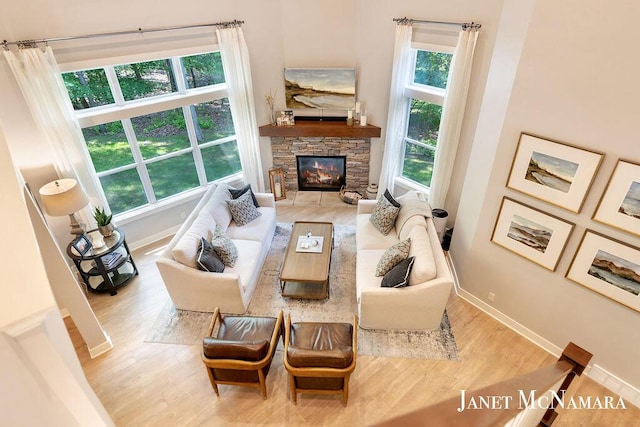 2078 Chippewa Dr Unit 25, Holland, MI 49424 - living room with wood finished floors, baseboards, and a fireplace