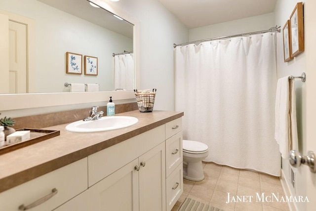 2078 Chippewa Dr Unit 25, Holland, MI 49424 - bathroom featuring toilet, vanity, tile patterned floors, and a shower with curtain