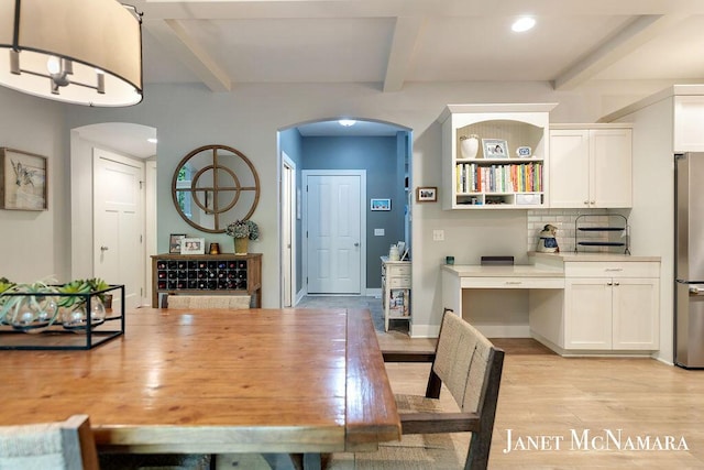 2078 Chippewa Dr Unit 25, Holland, MI 49424 - dining space with arched walkways, beam ceiling, light wood finished floors, and recessed lighting