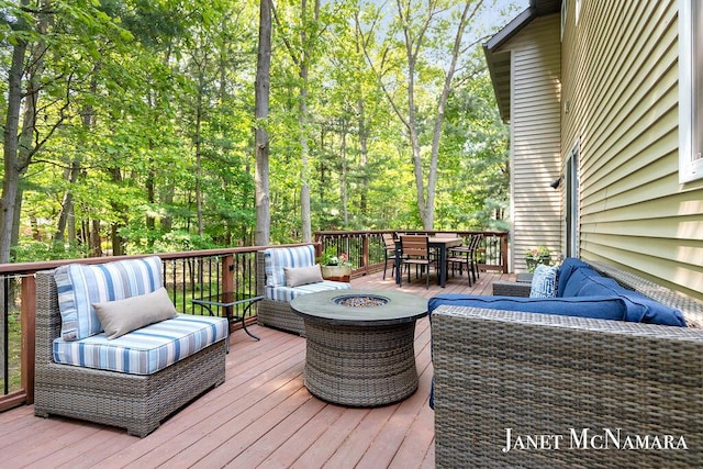 2078 Chippewa Dr Unit 25, Holland, MI 49424 - wooden terrace with an outdoor living space with a fire pit and outdoor dining area