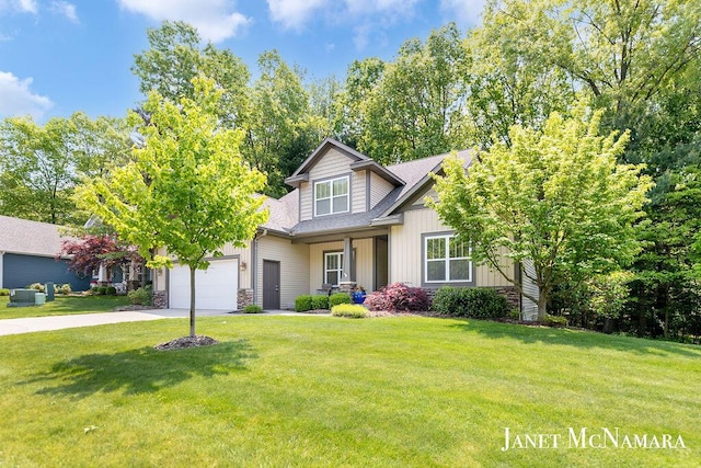 2078 Chippewa Dr Unit 25, Holland, MI 49424 - view of front of property featuring concrete driveway, a front lawn, a garage, stone siding, and a shingled roof