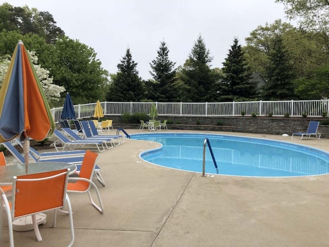 2078 Chippewa Dr Unit 25, Holland, MI 49424 - community pool featuring a patio area and view of scattered trees