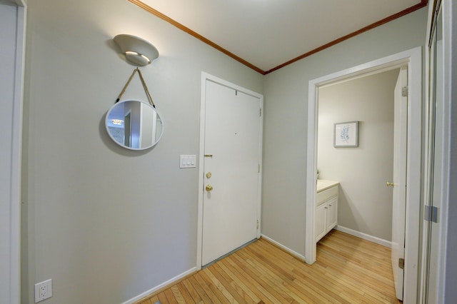 843 Greenhills Dr, Ann Arbor, MI 48105 - foyer with ornamental molding, light wood-style floors, and baseboards