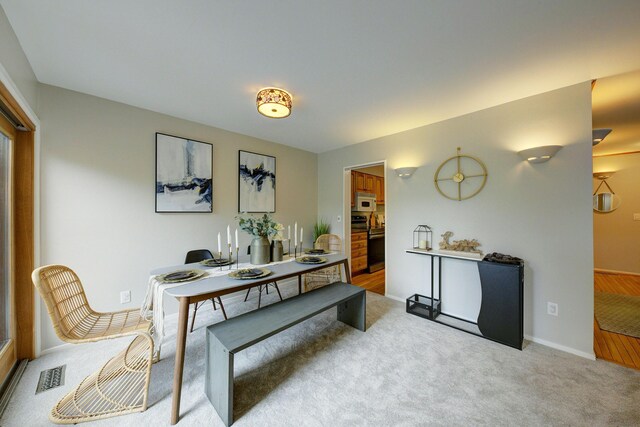 843 Greenhills Dr, Ann Arbor, MI 48105 - carpeted dining space with baseboards