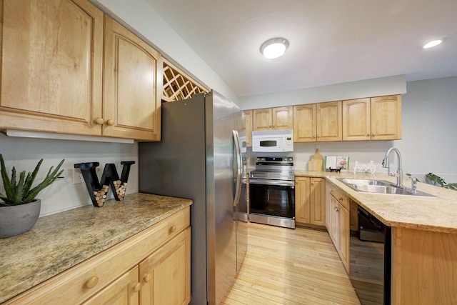 843 Greenhills Dr, Ann Arbor, MI 48105 - kitchen with stainless steel appliances, light brown cabinetry, a sink, light wood-style floors, and recessed lighting