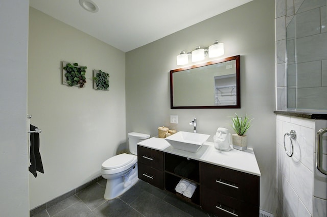 843 Greenhills Dr, Ann Arbor, MI 48105 - bathroom featuring tile patterned flooring, toilet, vanity, and a shower