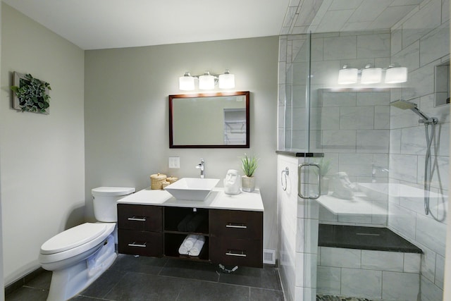 843 Greenhills Dr, Ann Arbor, MI 48105 - full bathroom featuring toilet, a shower stall, tile patterned flooring, and vanity