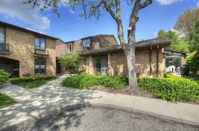 843 Greenhills Dr, Ann Arbor, MI 48105 - view of side of property featuring brick siding