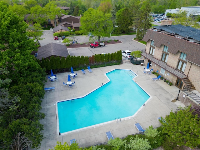 843 Greenhills Dr, Ann Arbor, MI 48105 - community pool featuring a patio and fence