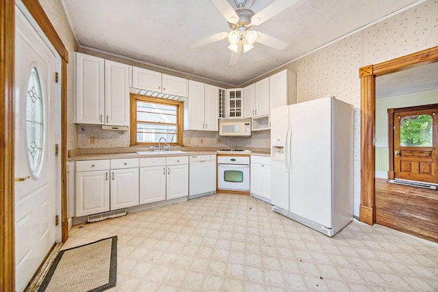 237 E Main St, Milan, MI 48160 - kitchen featuring white appliances, light floors, white cabinetry, a sink, and glass insert cabinets
