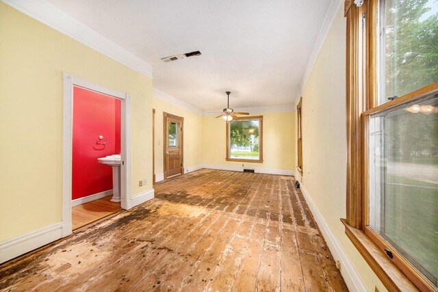 237 E Main St, Milan, MI 48160 - empty room featuring a ceiling fan, hardwood / wood-style floors, baseboards, and crown molding