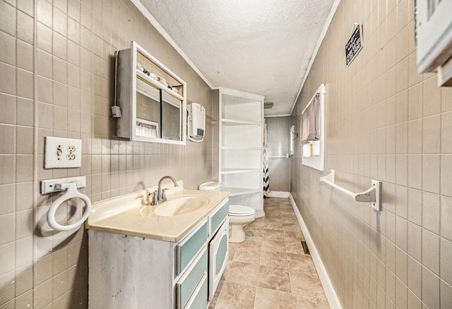 237 E Main St, Milan, MI 48160 - bathroom featuring a textured ceiling, toilet, ornamental molding, vanity, and tile walls