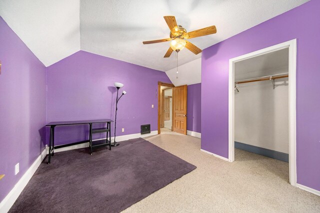 237 E Main St, Milan, MI 48160 - carpeted bedroom with vaulted ceiling, baseboards, ceiling fan, and a closet