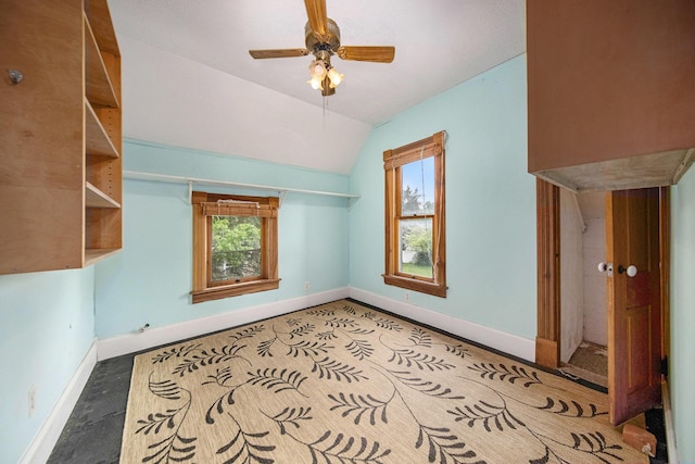 237 E Main St, Milan, MI 48160 - unfurnished room featuring baseboards, lofted ceiling, healthy amount of natural light, and ceiling fan