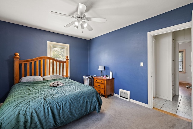 17270 Taft Rd, Spring Lake, MI 49456 - bedroom featuring multiple windows, carpet, a ceiling fan, and baseboards