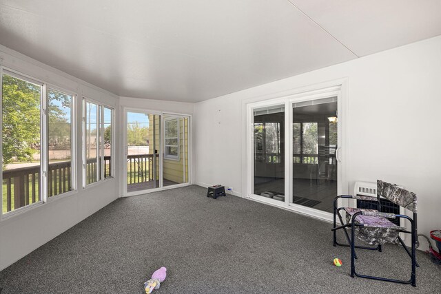 17270 Taft Rd, Spring Lake, MI 49456 - unfurnished sunroom featuring heating unit and carpet flooring