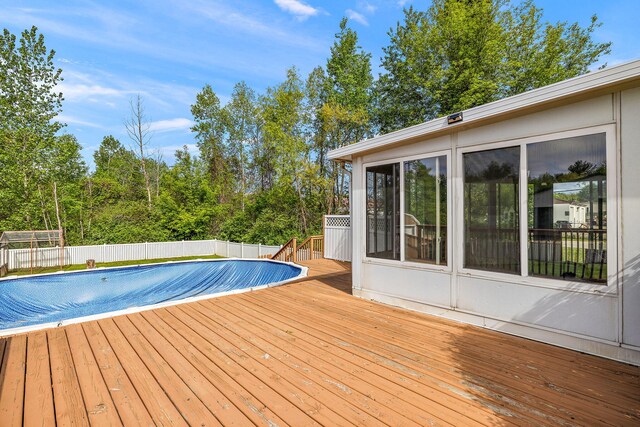 17270 Taft Rd, Spring Lake, MI 49456 - view of swimming pool with a wooden deck and a fenced backyard