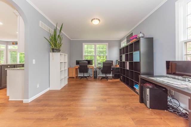 1218 Waterways Dr, Ann Arbor, MI 48108 - office area with light wood-style flooring, arched walkways, ornamental molding, and baseboards