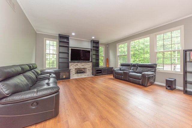 1218 Waterways Dr, Ann Arbor, MI 48108 - living room featuring crown molding, light wood-type flooring, baseboards, a fireplace, and recessed lighting