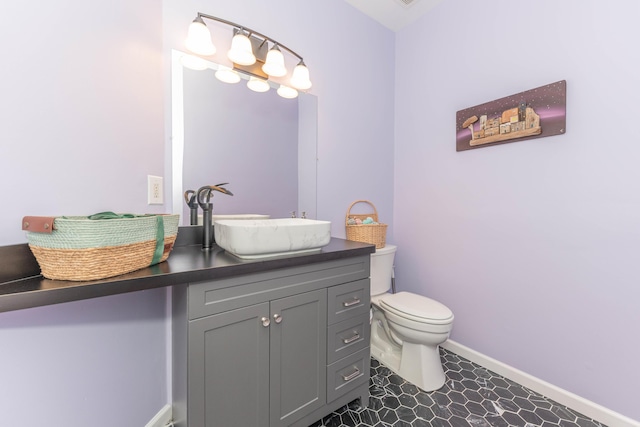 1218 Waterways Dr, Ann Arbor, MI 48108 - bathroom with vanity, toilet, and baseboards