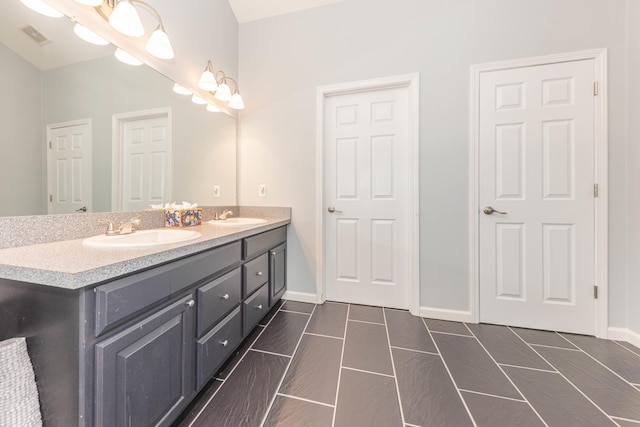 1218 Waterways Dr, Ann Arbor, MI 48108 - bathroom with double vanity and baseboards