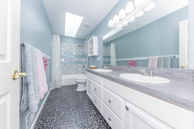 1218 Waterways Dr, Ann Arbor, MI 48108 - full bath featuring a skylight, shower / tub combo, double vanity, and toilet