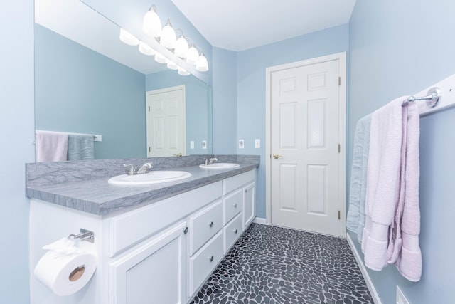 1218 Waterways Dr, Ann Arbor, MI 48108 - full bathroom with double vanity and baseboards