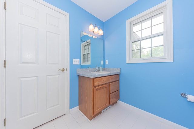 1218 Waterways Dr, Ann Arbor, MI 48108 - bathroom with baseboards and vanity