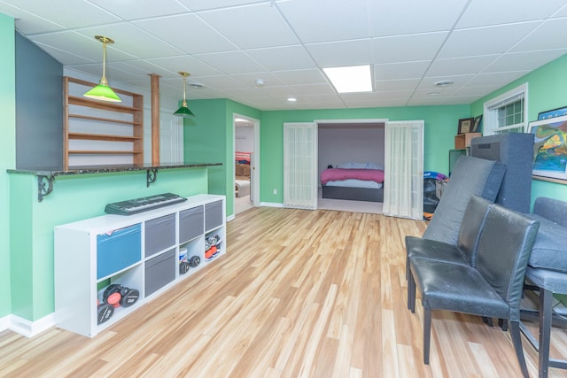 1218 Waterways Dr, Ann Arbor, MI 48108 - sitting room featuring a paneled ceiling, light wood finished floors, and baseboards