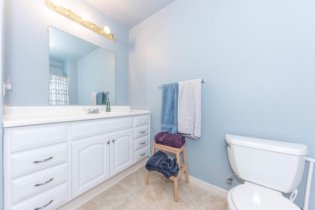 1218 Waterways Dr, Ann Arbor, MI 48108 - full bathroom featuring toilet, vanity, baseboards, and tile patterned floors