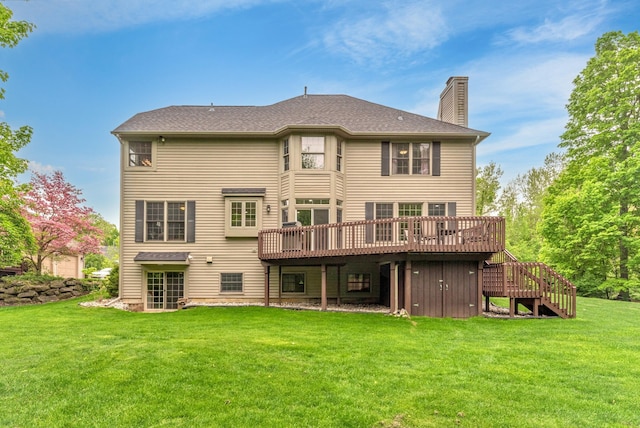1218 Waterways Dr, Ann Arbor, MI 48108 - rear view of house featuring a chimney, a wooden deck, stairway, and a yard