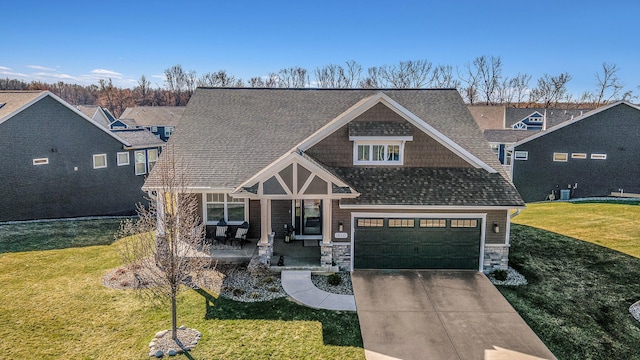 821 Janelle Ct, Portage, MI 49024 - view of front facade with a front yard, concrete driveway, and stone siding