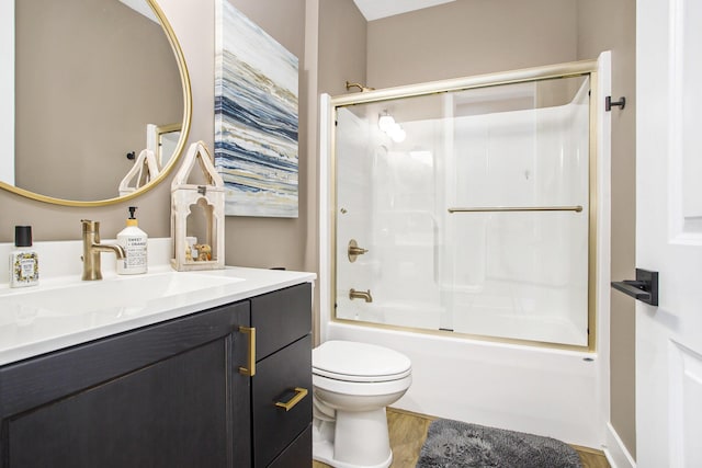821 Janelle Ct, Portage, MI 49024 - bathroom featuring toilet, shower / bath combination with glass door, vanity, and wood finished floors
