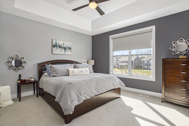 821 Janelle Ct, Portage, MI 49024 - bedroom with a raised ceiling, light colored carpet, baseboards, and a ceiling fan