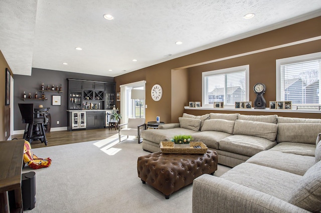 821 Janelle Ct, Portage, MI 49024 - living room with a bar, recessed lighting, a textured ceiling, beverage cooler, and baseboards