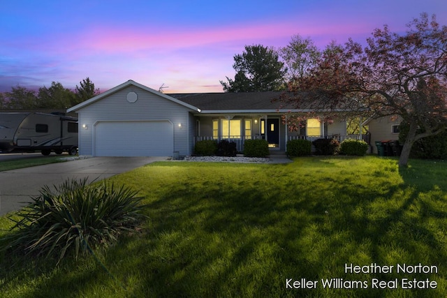 ranch-style home with an attached garage, a porch, a yard, and driveway