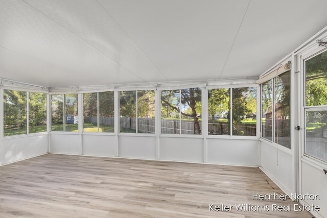 unfurnished sunroom with healthy amount of natural light