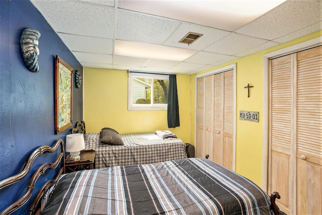 15467 Wisteria Ln, Spring Lake, MI 49456 - bedroom with a drop ceiling and multiple closets