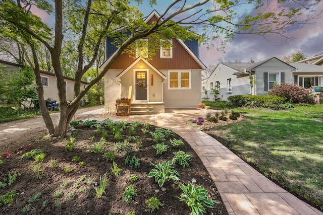 1435 Harpst St, Ann Arbor, MI 48104 - view of front of house with stucco siding and a front lawn