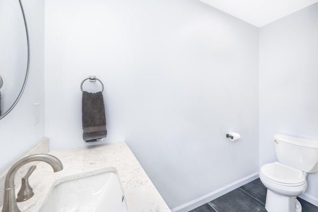 1435 Harpst St, Ann Arbor, MI 48104 - bathroom with a sink, tile patterned flooring, toilet, and baseboards