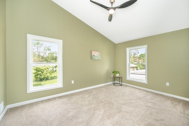 1435 Harpst St, Ann Arbor, MI 48104 - spare room with light colored carpet, vaulted ceiling, baseboards, and a ceiling fan