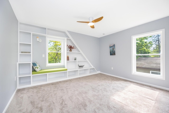 1435 Harpst St, Ann Arbor, MI 48104 - carpeted spare room featuring healthy amount of natural light, a ceiling fan, and baseboards