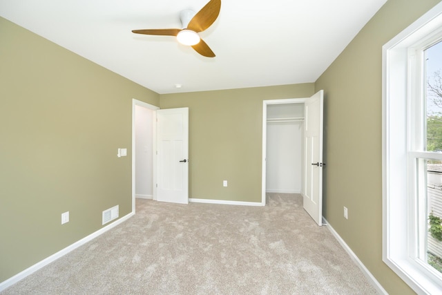 1435 Harpst St, Ann Arbor, MI 48104 - unfurnished bedroom with multiple windows, carpet flooring, and baseboards