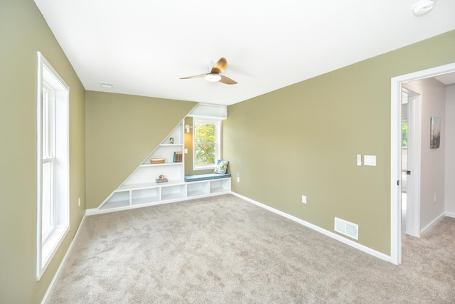 1435 Harpst St, Ann Arbor, MI 48104 - empty room featuring ceiling fan, carpet floors, a smoke detector, and baseboards
