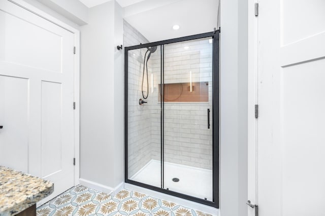 1435 Harpst St, Ann Arbor, MI 48104 - full bathroom featuring baseboards, a shower stall, tile patterned floors, and recessed lighting